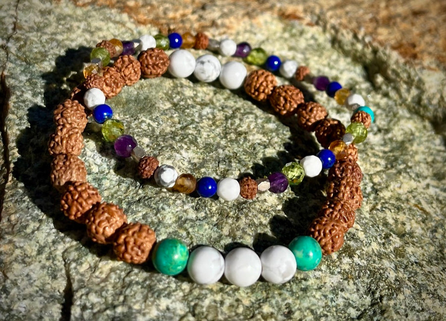 In Living Color bracelet stack with various gemstones and rudraksha seeds.