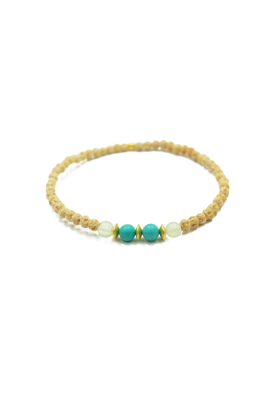  A captivating Lanikai Bracelet, designed to pair perfectly with the Lanikai Sunrise Mala Necklace. The bracelet features delicate 2mm prehnite, turquoise, and rudrani beads, accented with 22k gold details. Immerse yourself in the blissful essence of weightlessly floating in aquamarine waves under the tropical sun with this enchanting accessory.