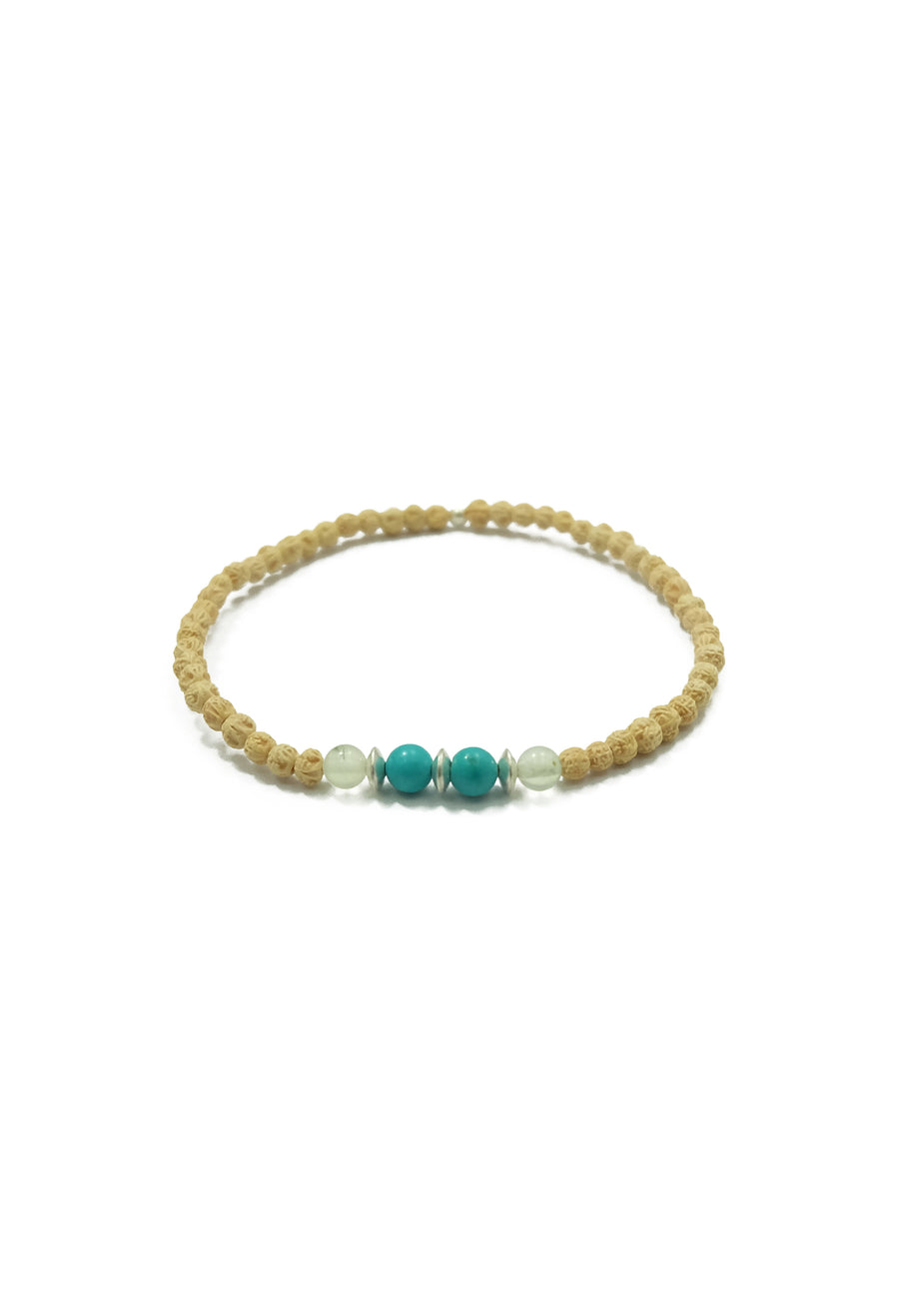 A captivating Lanikai Bracelet, designed to pair perfectly with the Lanikai Sunrise Mala Necklace. The bracelet features delicate 2mm prehnite, turquoise, and rudrani beads, accented with silver details. Immerse yourself in the blissful essence of weightlessly floating in aquamarine waves under the tropical sun with this enchanting accessory.