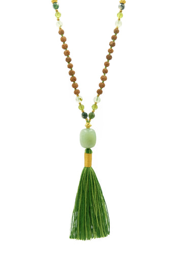 The Green Earth Goddess mala featuring aventurine, moss agate, prehnite and peridot evokes the cool lushness of ferns by the creekside, misty boulders covered in resilient moss, and the verdant abundance of a summer garden. 