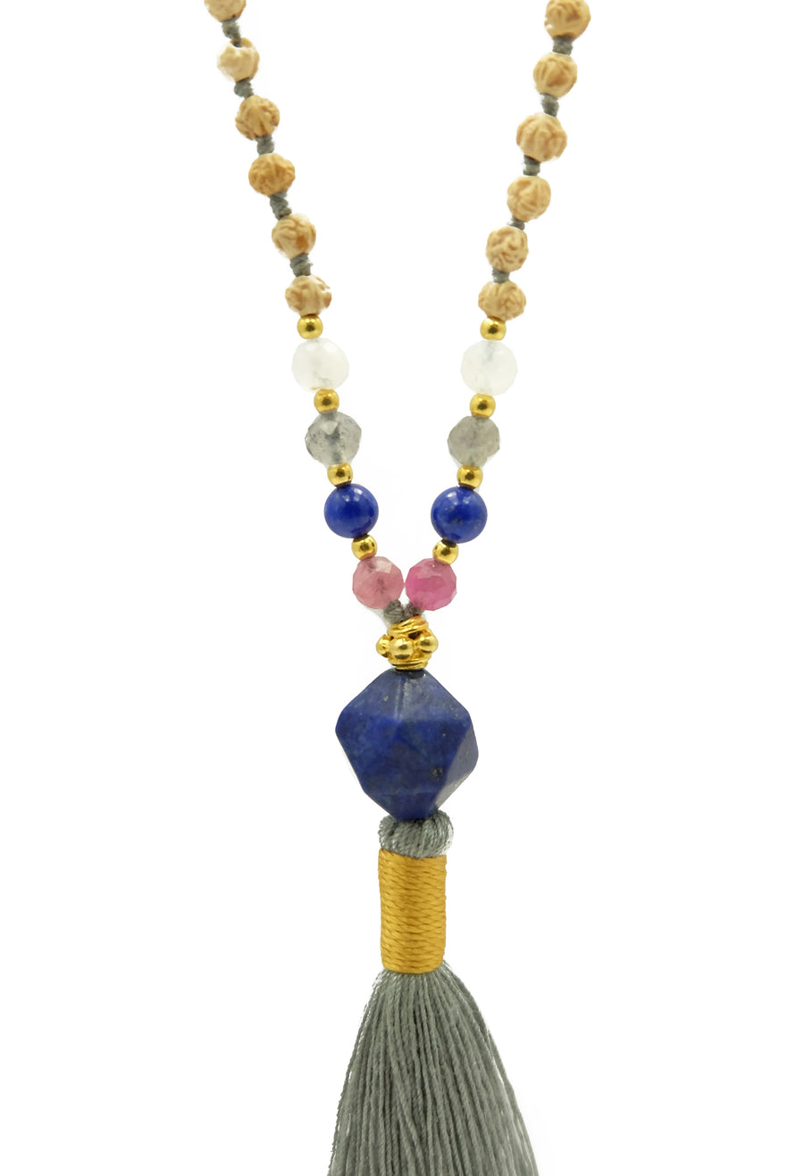 Image: Ice Moon Mala - Cooling Gemstones | Moonstone, Labradorite, Tourmaline | Rudrani Seeds | 22k Gold Accents | Lapis Lazuli Pendant. Find balance and tranquility with this serene Ice Moon Mala inspired by Native American tradition. Calm irritable moods and perfectionist minds with the cooling, calming nature of moonstone, labradorite, and tourmaline gemstones. Ideal for spiritual seekers and those seeking inner harmony.