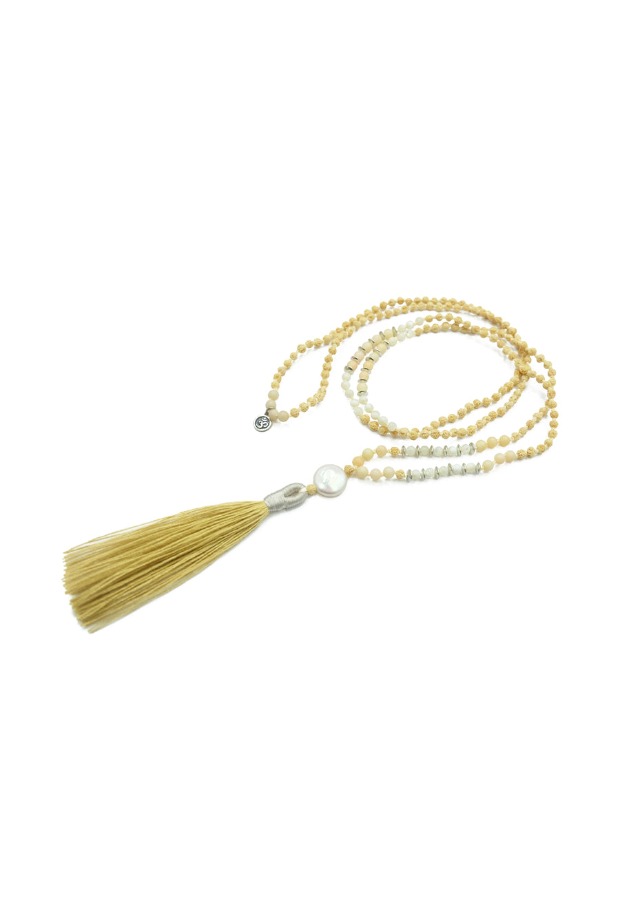 Uluwatu Moon Mala featuring pearls, corals, moonstone, and elegant sterling silver accents by www.balimalas.com.